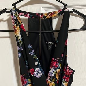 Express US 2 floral shorts romper with tie waist and zip side. Worn once.